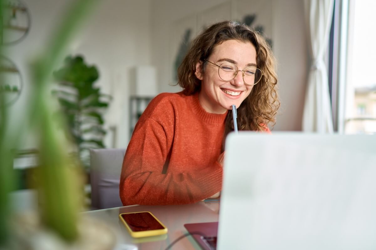 Woman smiling on laptop