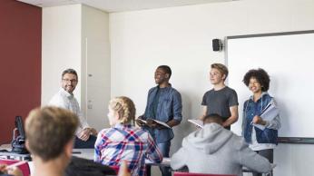 older kids presenting in front of class