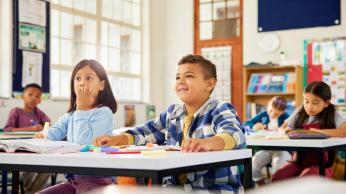 Young students attentive in classroom.