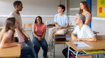 Students sitting around each other.