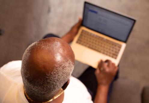 man-in-white-shirt-using-macbook-pro