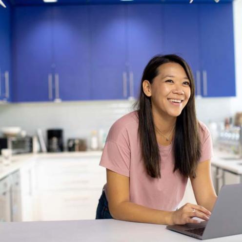 woman-in-pink-crew-neck-t-shirt-using-laptop