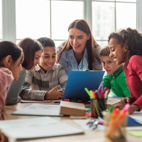 Teacher with a diverse group of students.
