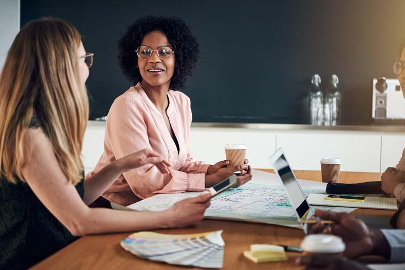 women at conference desk