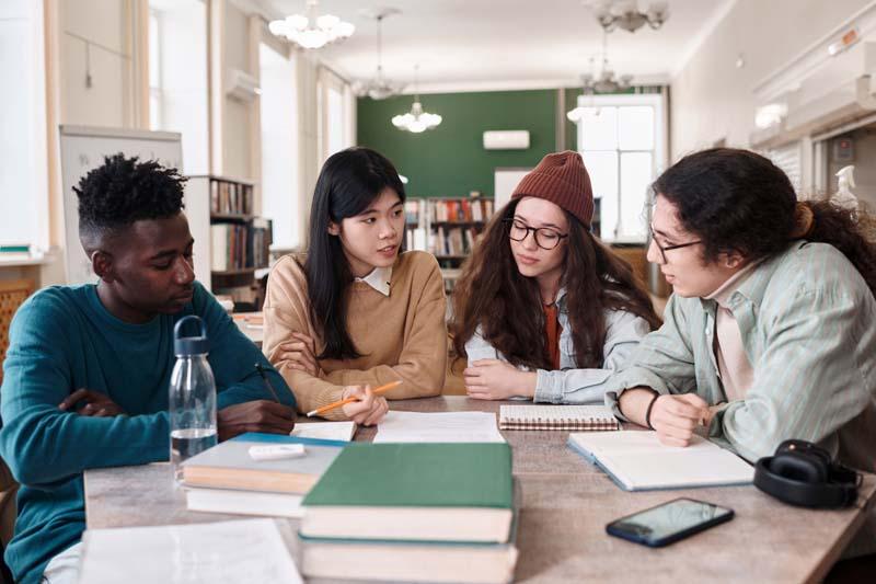 older kids in small group at table 