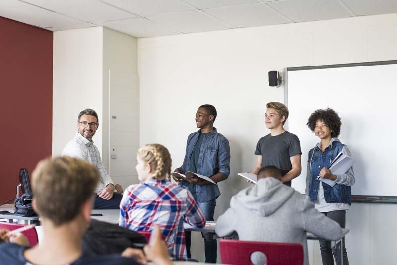 older kids presenting in front of class