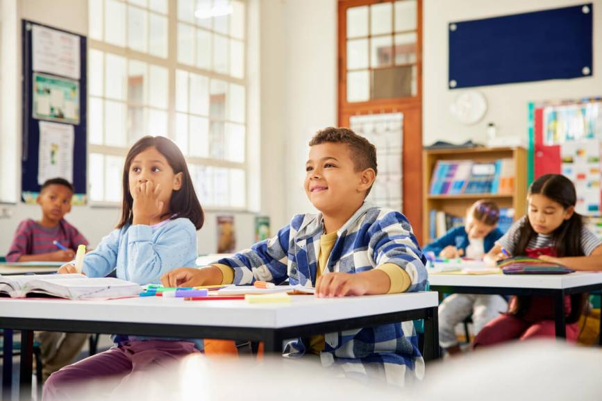 Young students attentive in classroom.