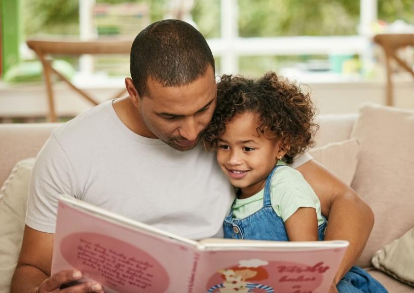 Parent and child reading together.
