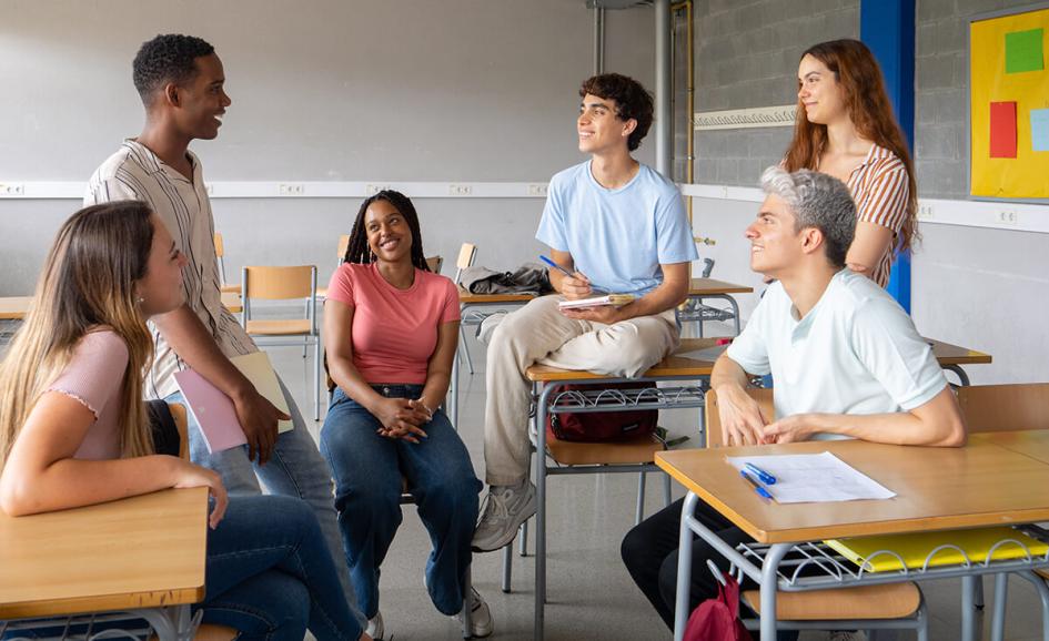 Students sitting around each other.