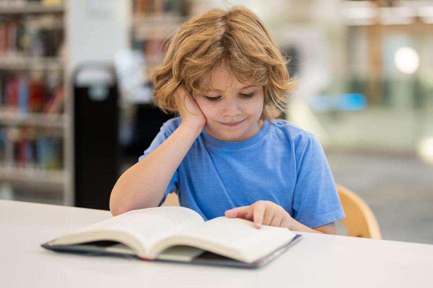 Child reading a book.