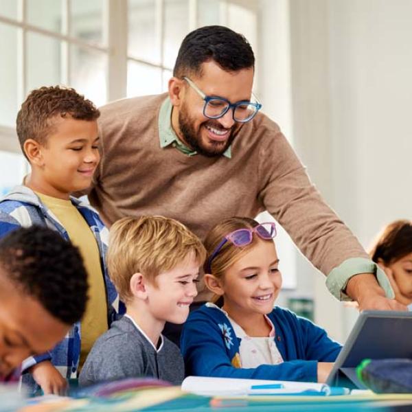 teacher and kids on computer