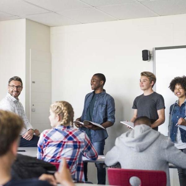 older kids presenting in front of class